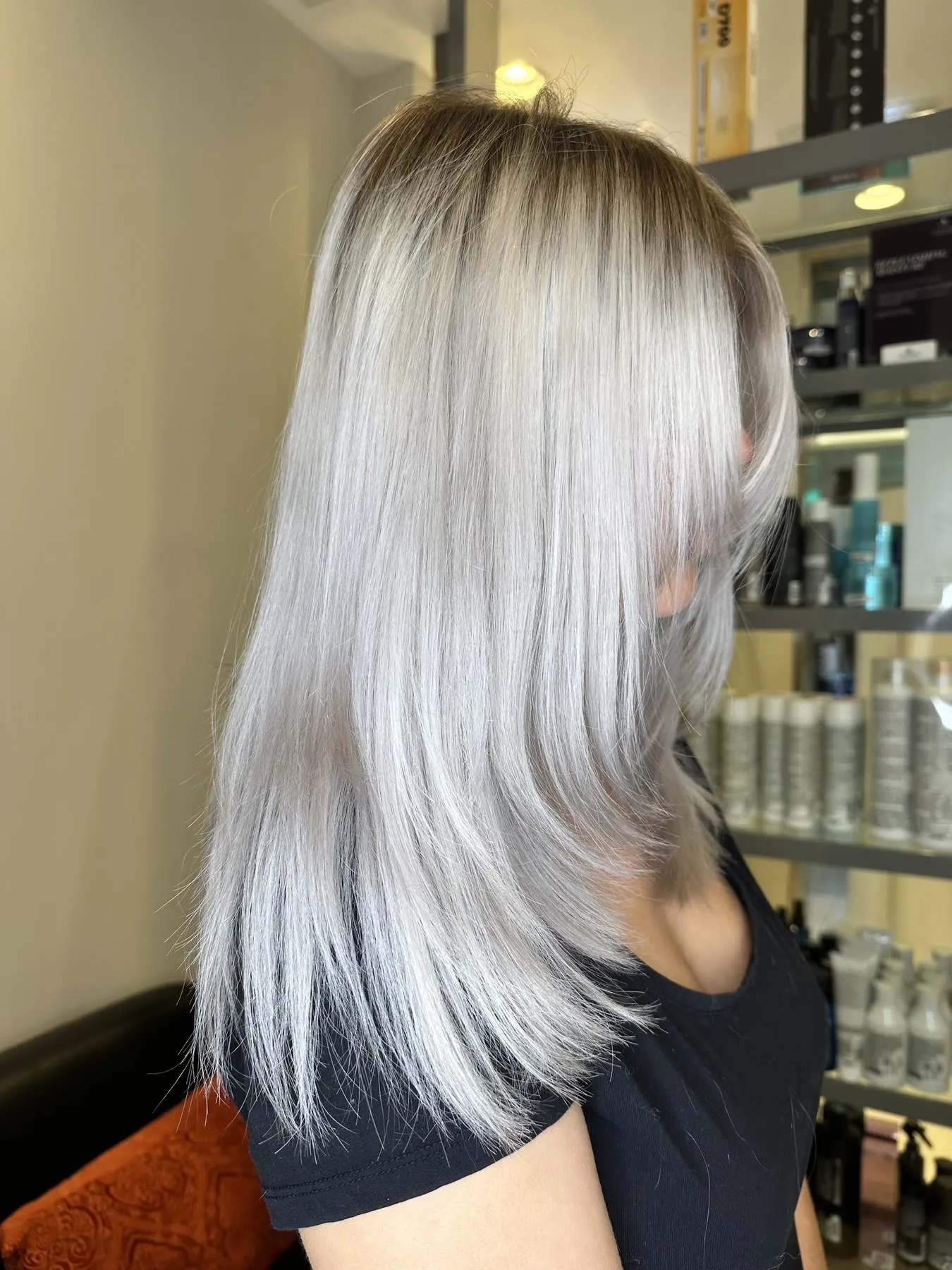 Icy platinum blonde, sleek and straight, by Ronak Hairstylist in Toronto