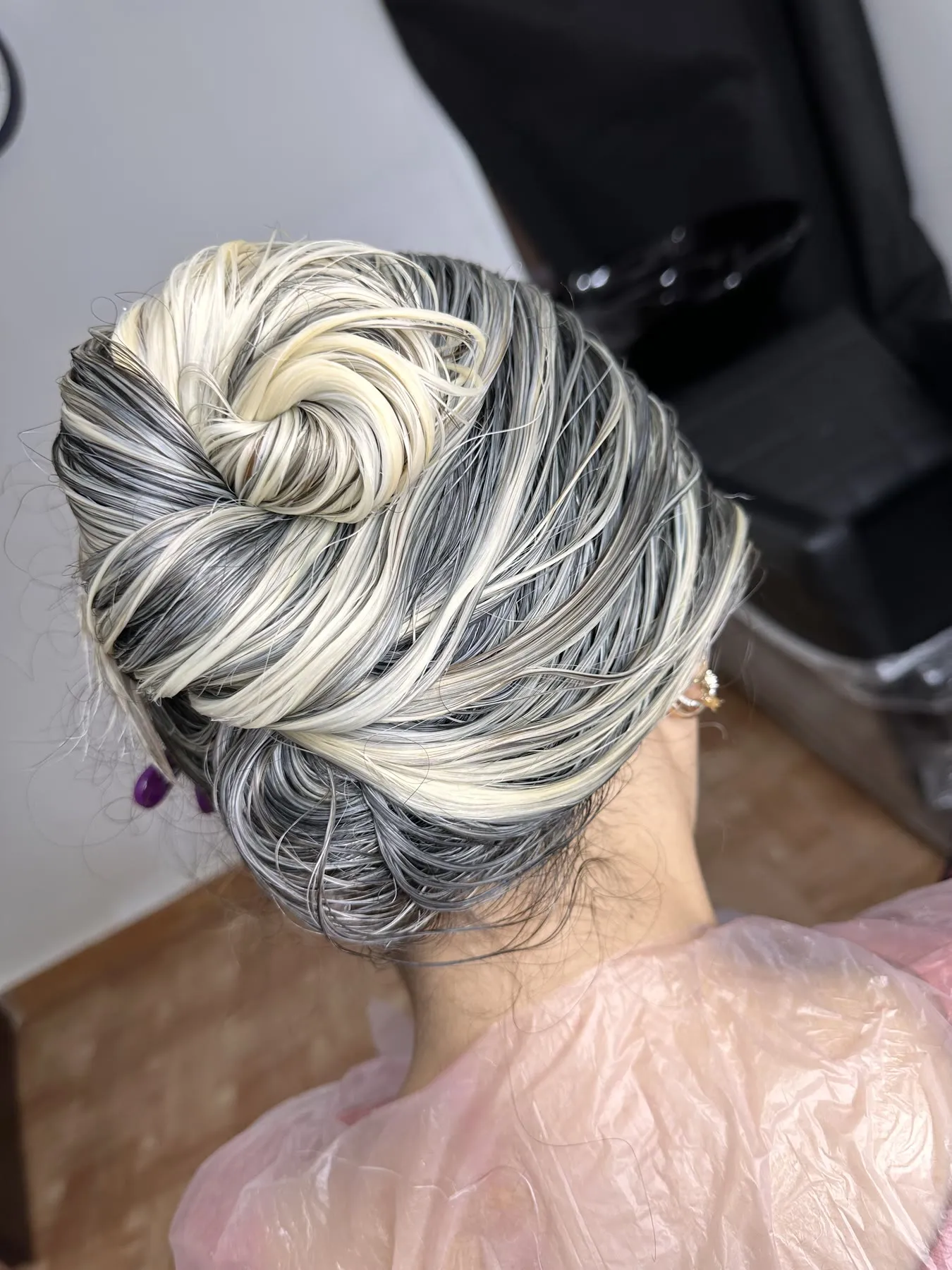 Twisted updo through silver highlights by Ronak Hairstylist in Toronto