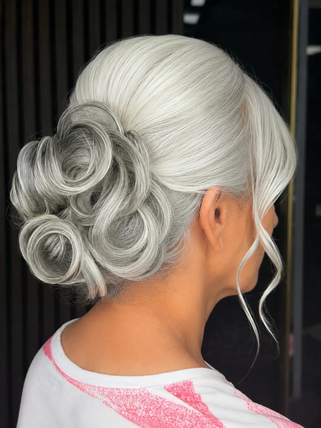 Sculpted silver-white updo with pin curls, side view, by Ronak Hairstylist in Toronto
