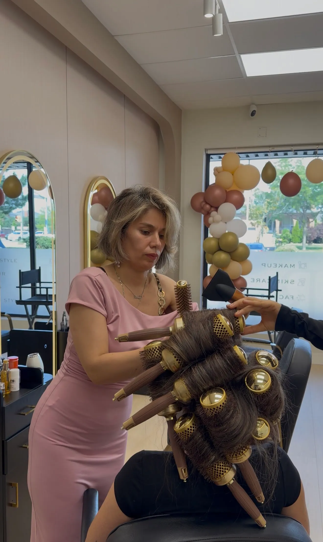 Ronak setting round brushes for a blow-dry in her Toronto salon